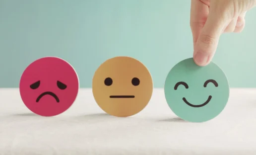 Hand choosing green happy smiley face paper cut, product, user, service feedback rating and customer reveiw, experience, satisfaction survey, psychology mental health test concept