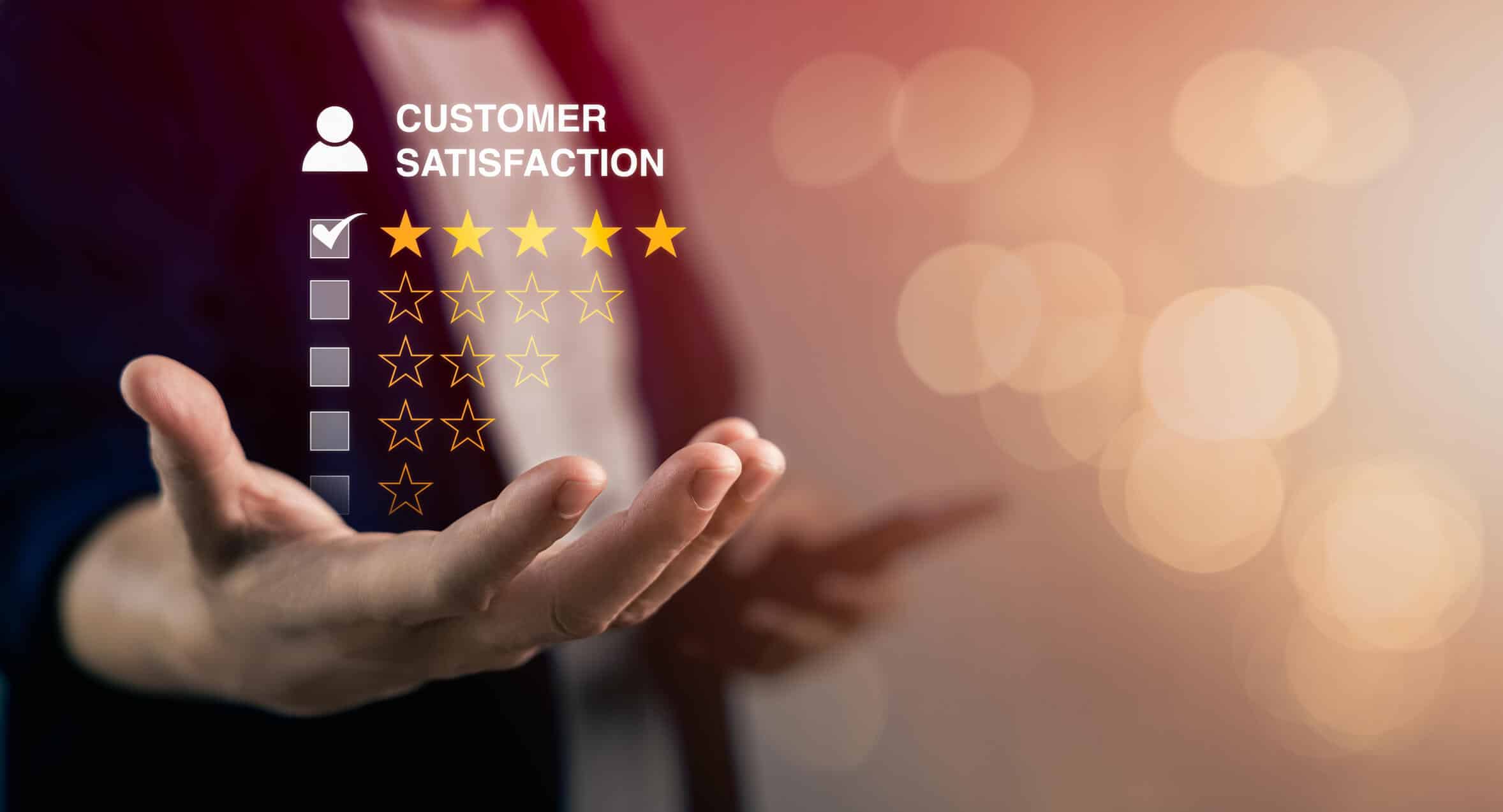 graphic of hand holidng customer satisfaction stars
