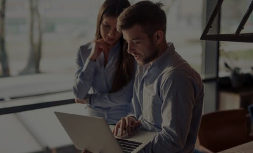 a customer experience consultant showing a person an interaction metrics report