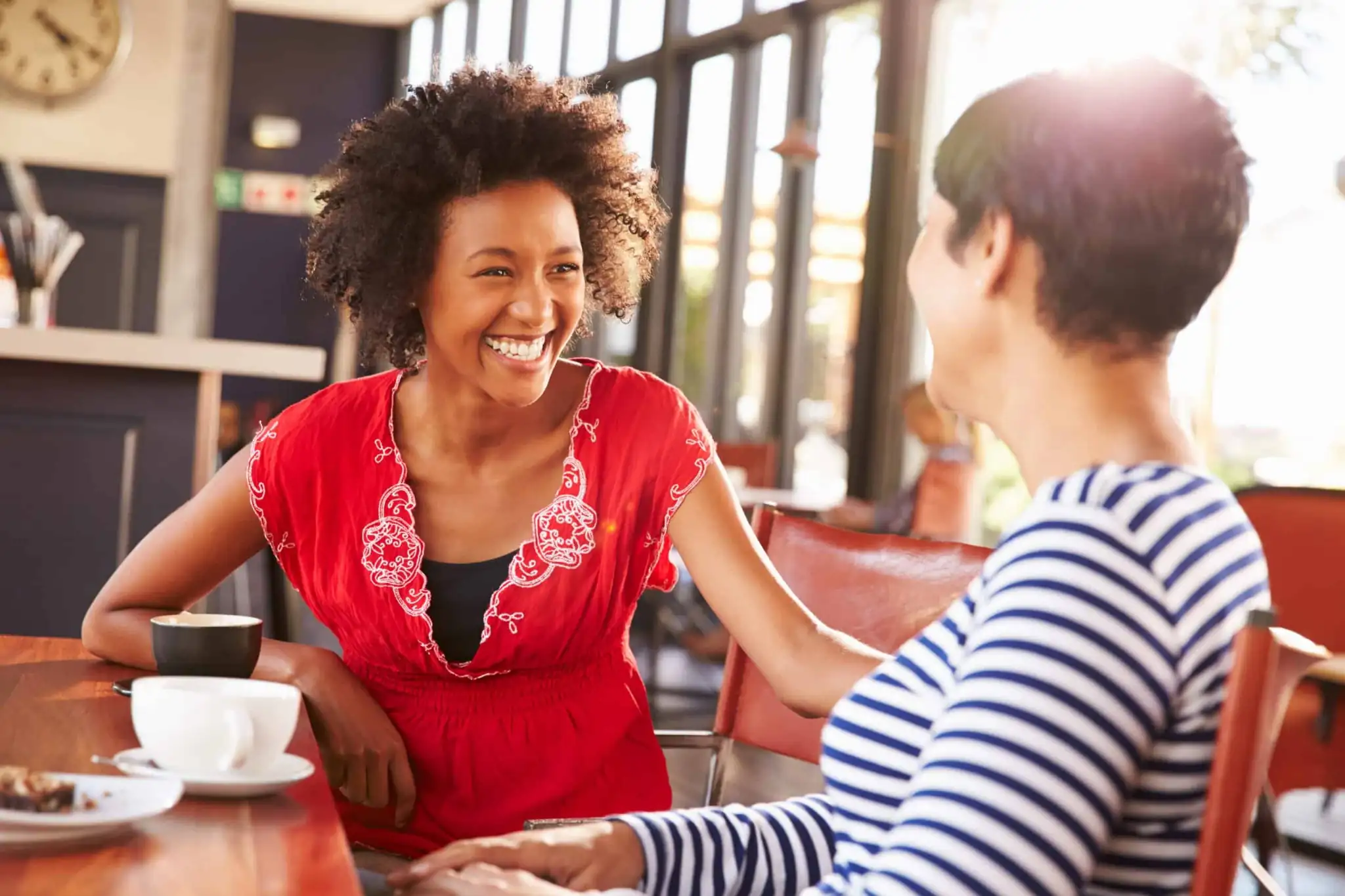 two women demonstrating friendly customer service