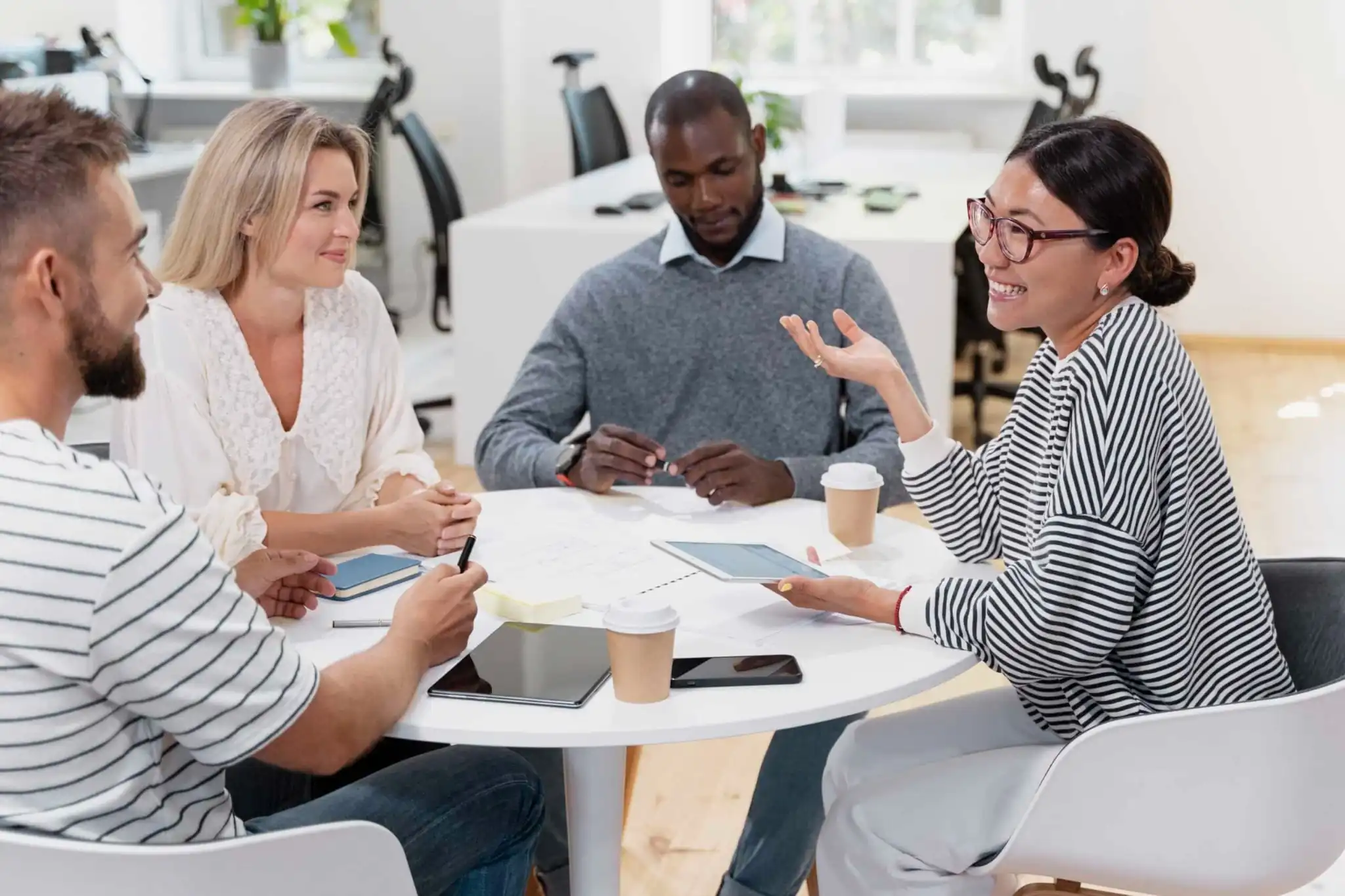 woman conducting customer interviews to collect data and gain key insights as part of Interaction Metrics' voice of the customer program