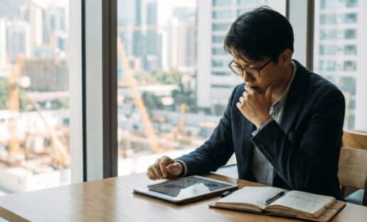 a man reviewing NPS score after an Interaction Metrics NPS Survey