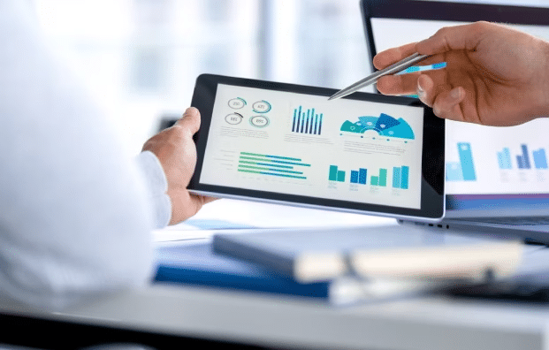 person viewing survey results on a tablet after using the correct survey sampling methods