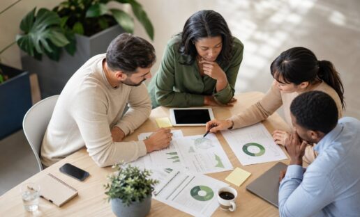 analysts reviewing customer experience metrics and customer data