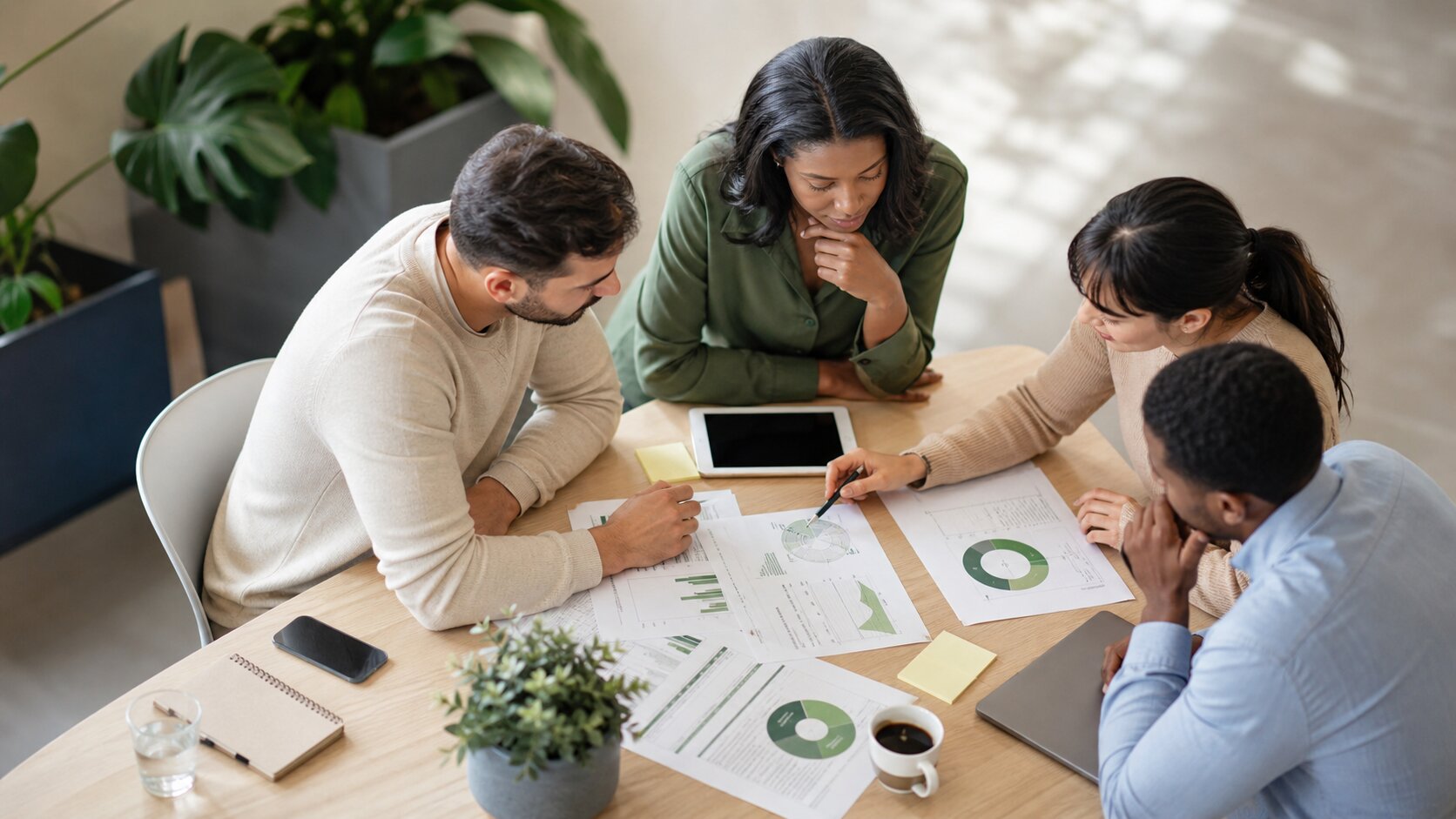analysts reviewing customer experience metrics and customer data
